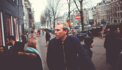 Man walking through town.