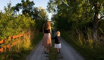 Mother and daughter walking and dealing with grief while discussing heartbreak.