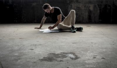 Man absorbed in working on his plan for healing after divorce.