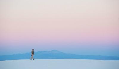 A man wandering alone thinking about how to deal with loneliness.