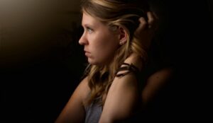 Woman lost in thought about how infidelity changes you.