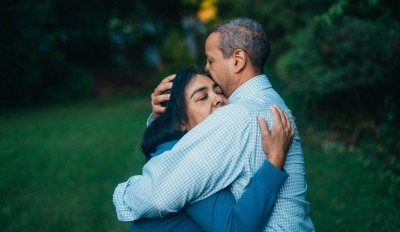 Woman embracing her husband after discovering how to get over an affair your husband had.