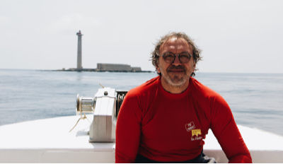 Happy man afloat in his boat who discovered how to start over after divorce.