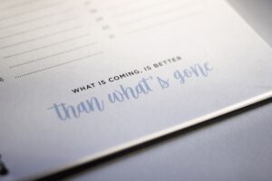 Notepad with one of the best life-after-divorce quotes: What is coming, is better than what’s gone.