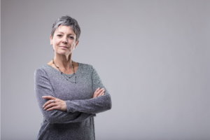 Woman standing confidently in knowing that she's gained self-awareness from her divorce.